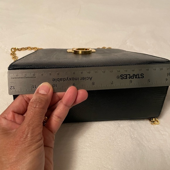 Authentic Salvatore Ferragamo black leather bag with shiny gold metal handle. - Picture 5 of 11